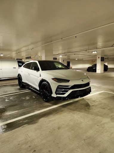 White Lamborghini Urus detailed in a Phoenix parking garage